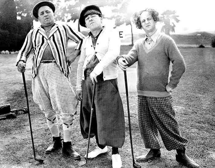 The Three Stooges standing with golf clubs